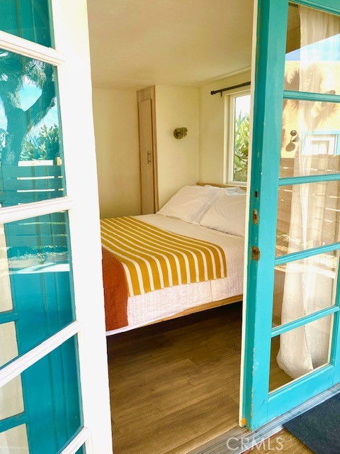 62238 Rincon Road Joshua Tree, CA 92252 - Photo 26 of 60 a bedroom with a bed and a window