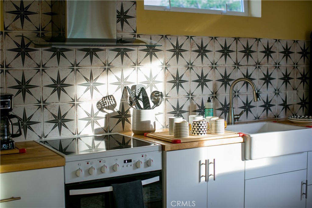 62238 Rincon Road Joshua Tree, CA 92252 - Photo 35 of 60 a kitchen with a sink and cabinets