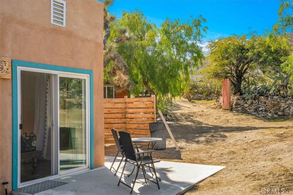 62238 Rincon Road Joshua Tree, CA 92252 - Photo 47 of 60 a view of a patio with a table and chairs