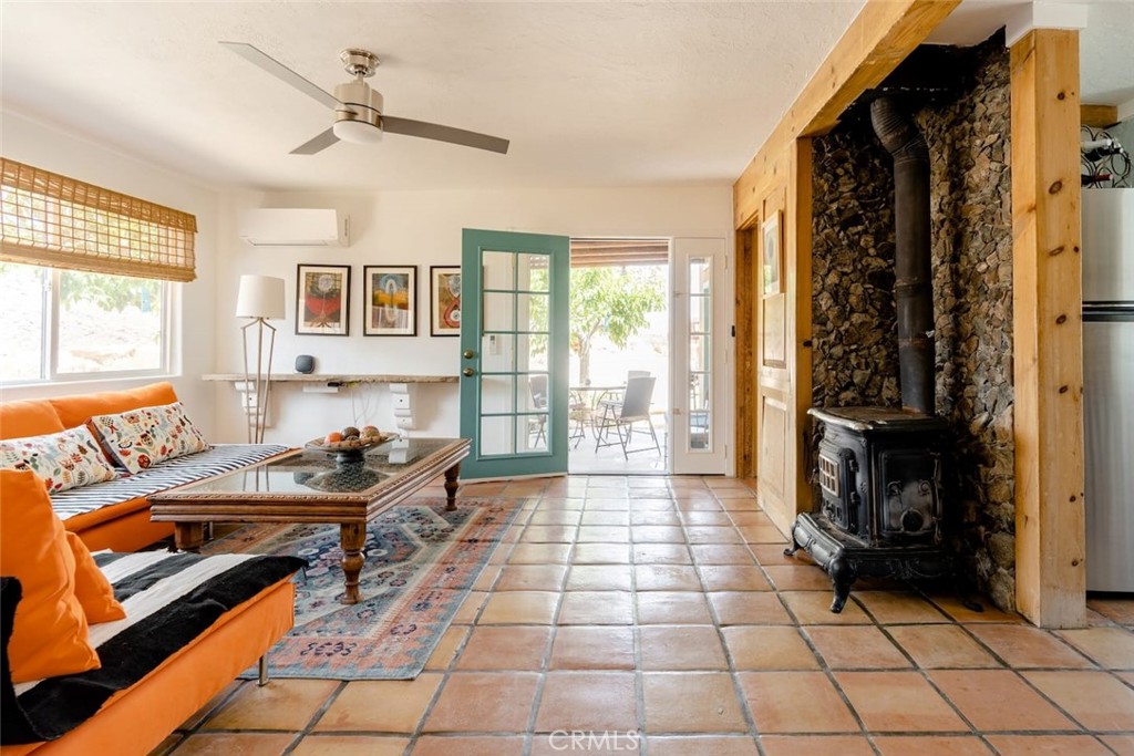 62238 Rincon Road Joshua Tree, CA 92252 - Photo 7 of 60 a living room with furniture and a fireplace