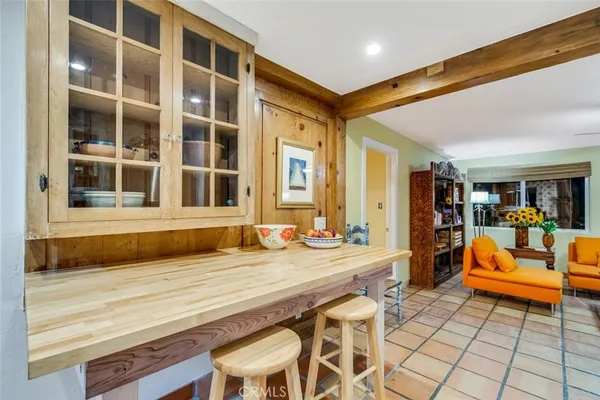 a living room with a large window and table