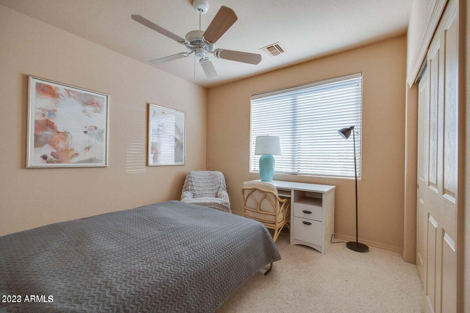 25603 North Sago Drive Rio Verde, AZ 85263 - Photo 12 of 25 a bedroom with a bed and a window