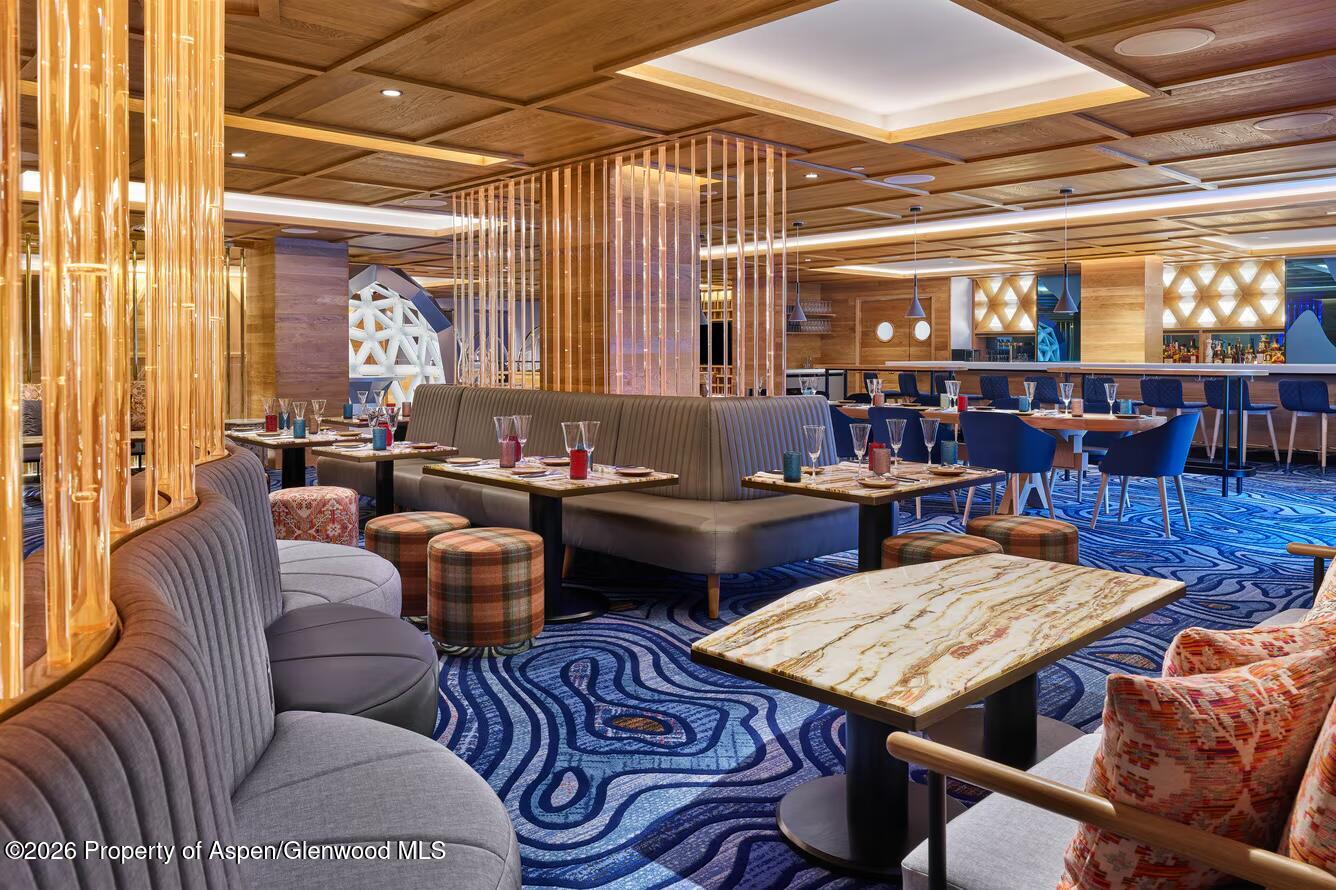 550 South Spring Street, Unit F72 Aspen, CO 81611 - Photo 14 of 16 a living room with furniture and a table