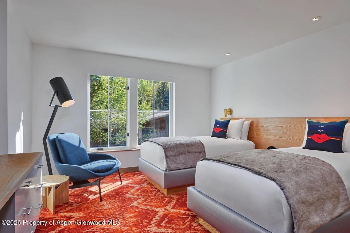 550 South Spring Street, Unit F72 Aspen, CO 81611 - Photo 6 of 16 a living room with furniture and a large window
