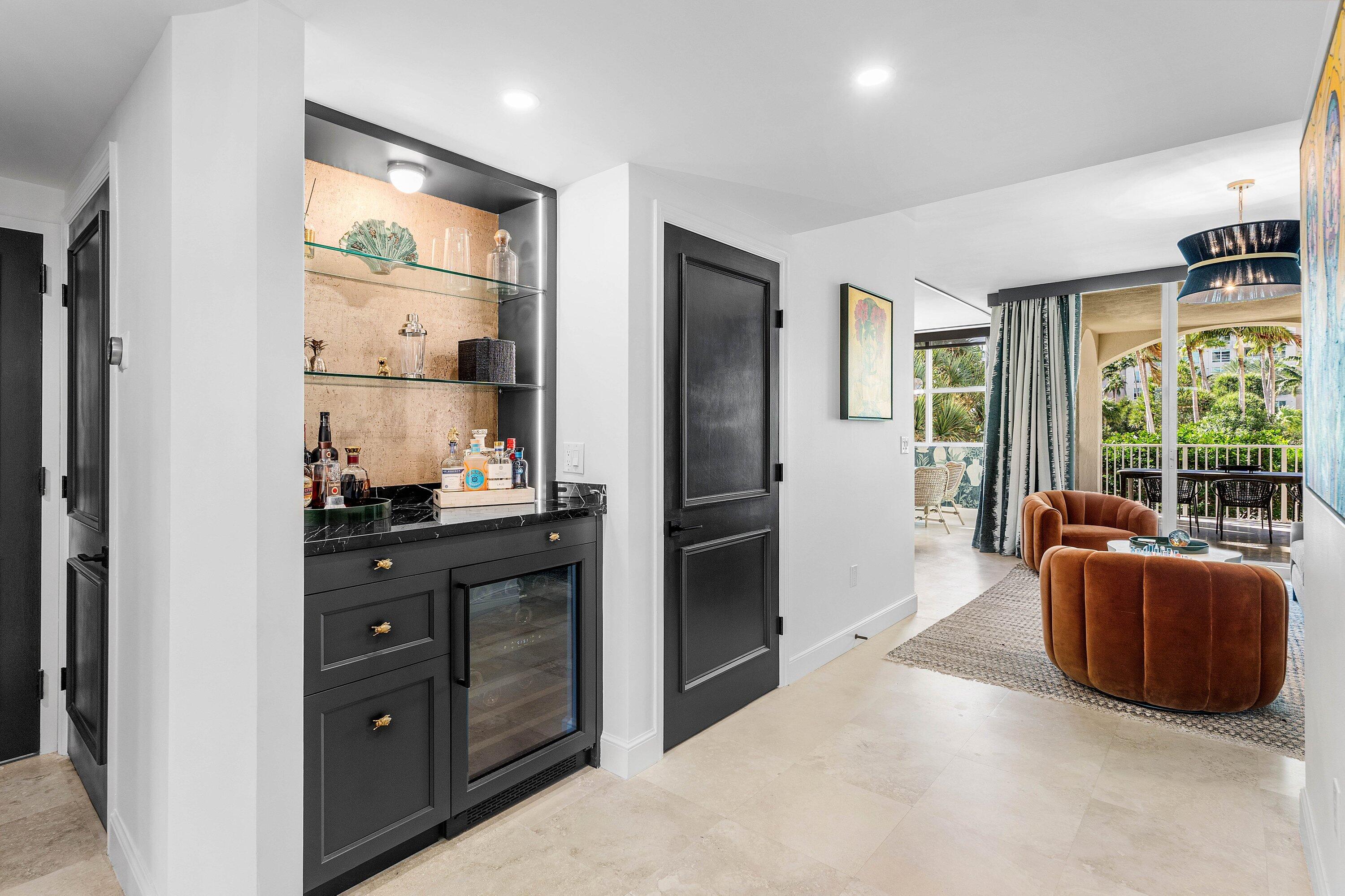3700 South Ocean Boulevard, Unit 202 Highland Beach, FL 33487 - Photo 13 of 75 a kitchen with stainless steel appliances granite countertop a refrigerator and a sink