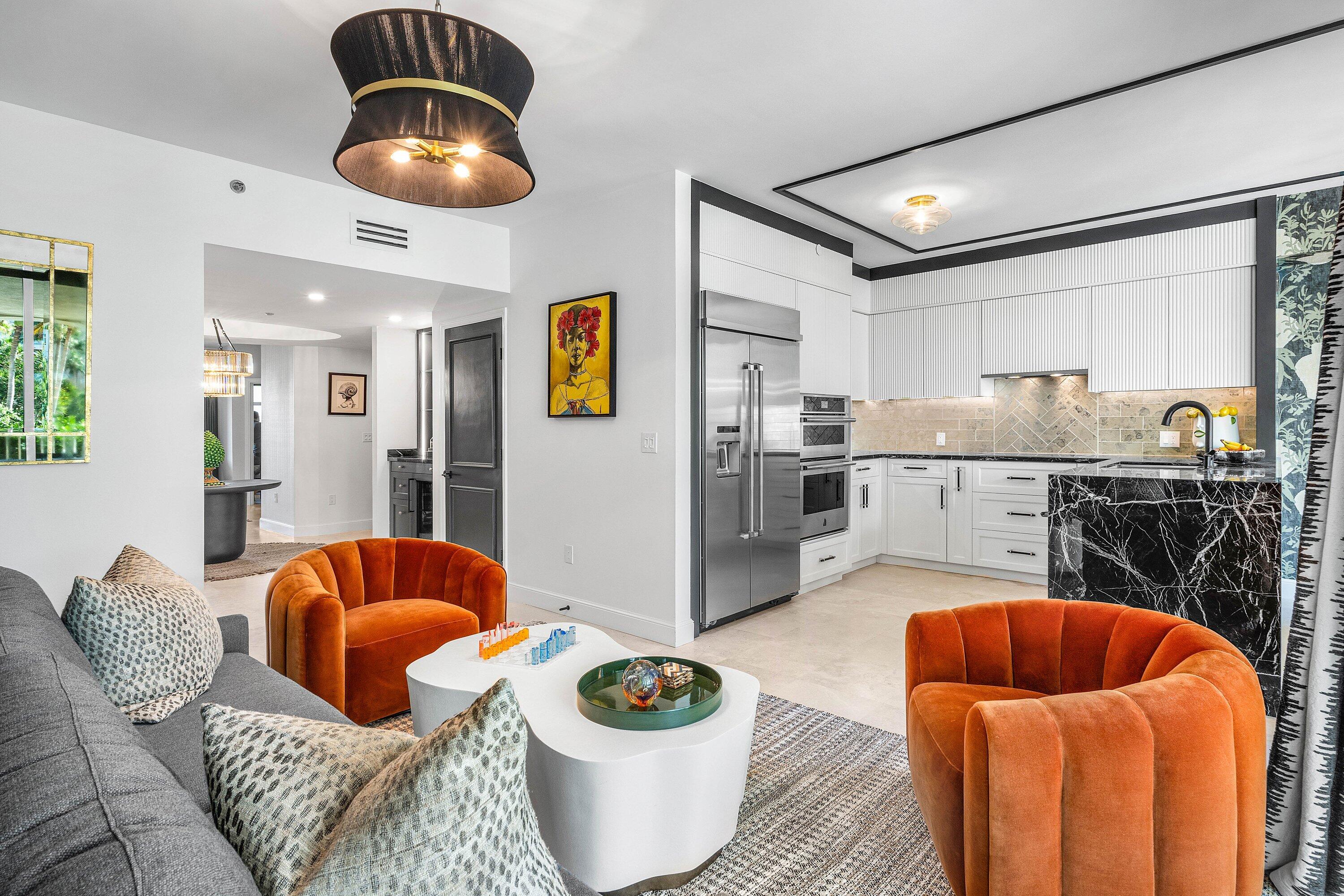 3700 South Ocean Boulevard, Unit 202 Highland Beach, FL 33487 - Photo 18 of 75 a living room with stainless steel appliances furniture and a view of kitchen