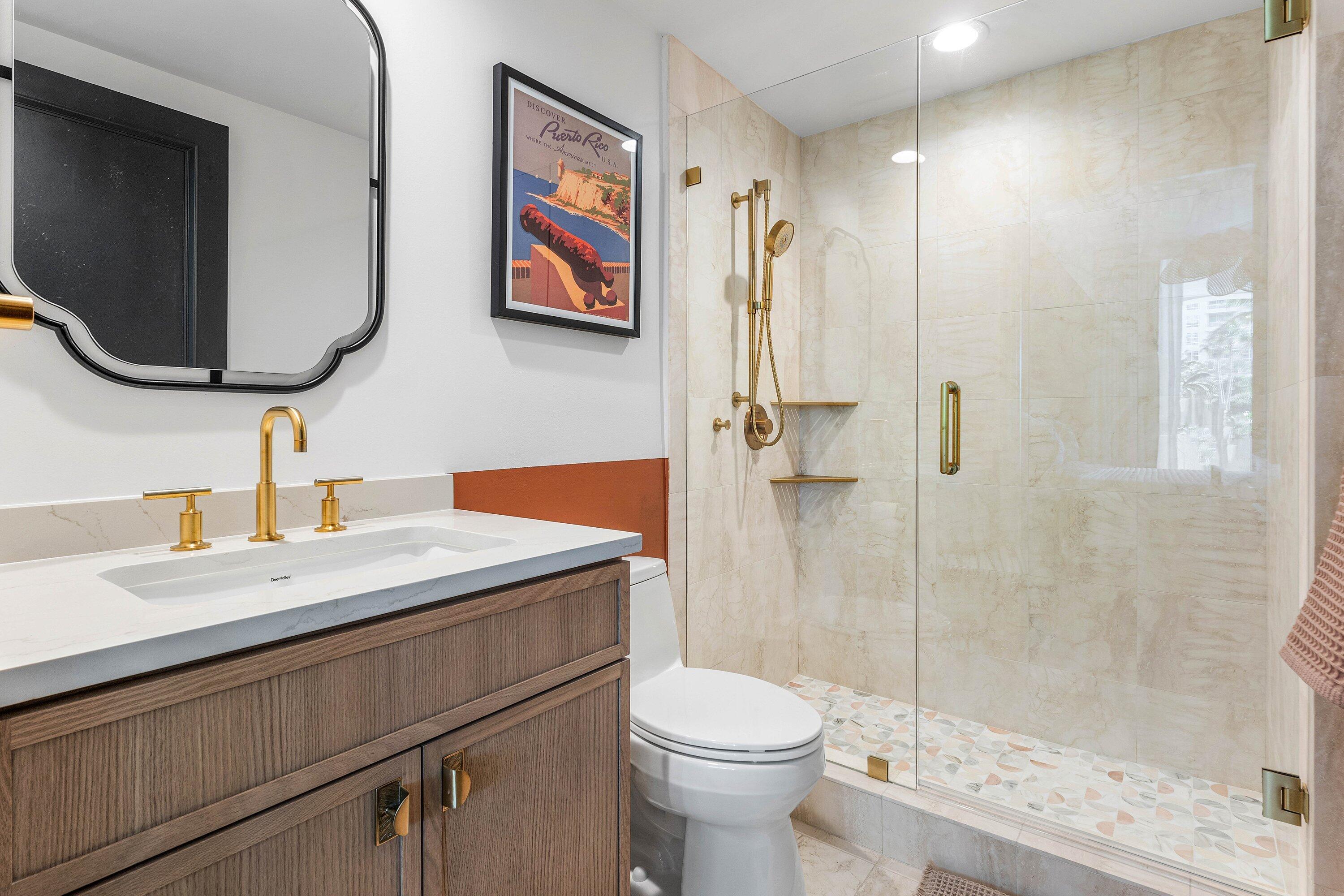 3700 South Ocean Boulevard, Unit 202 Highland Beach, FL 33487 - Photo 25 of 75 a bathroom with a sink a toilet and shower