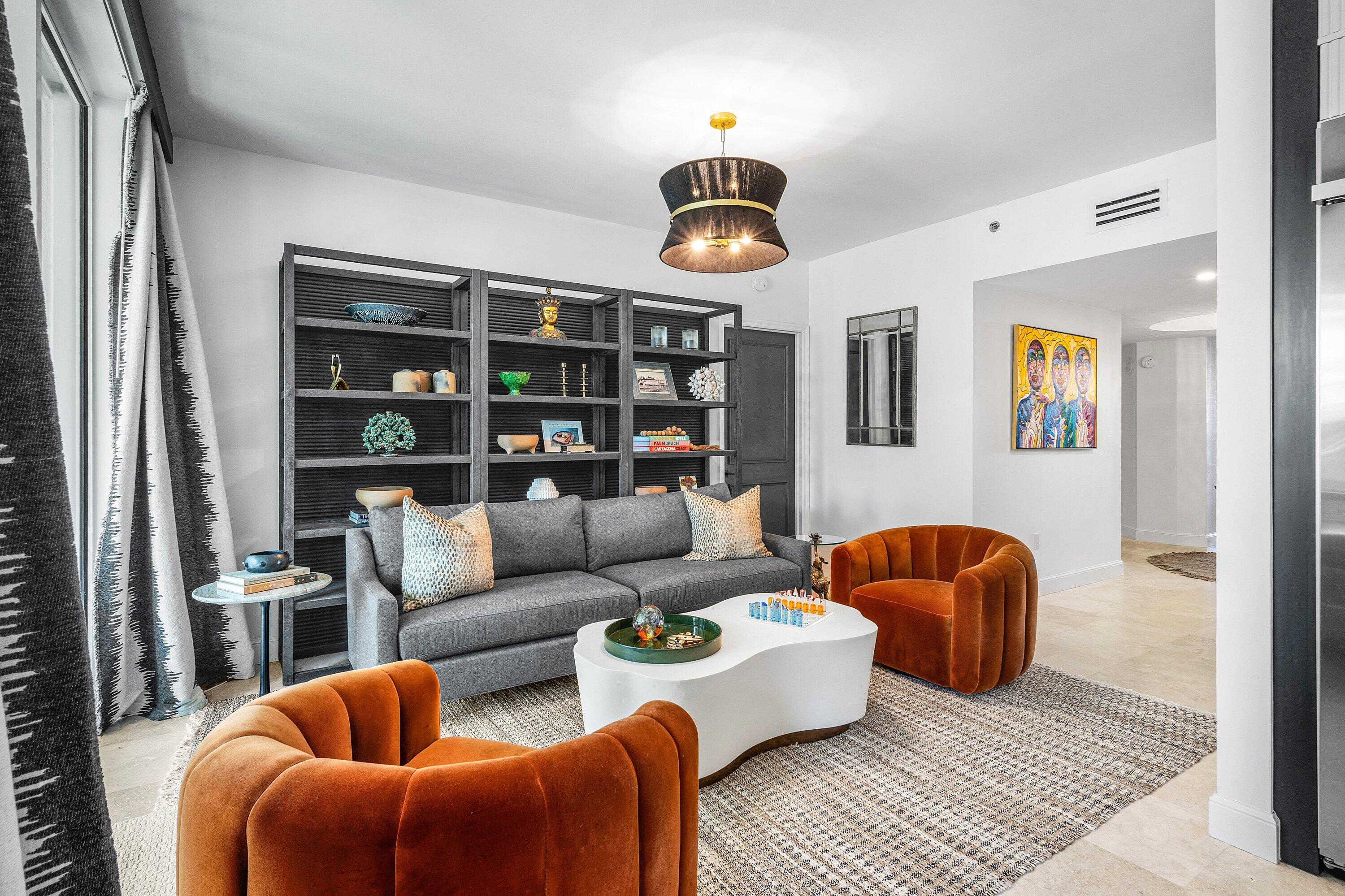 3700 South Ocean Boulevard, Unit 202 Highland Beach, FL 33487 - Photo 3 of 75 a living room with furniture a rug and a window