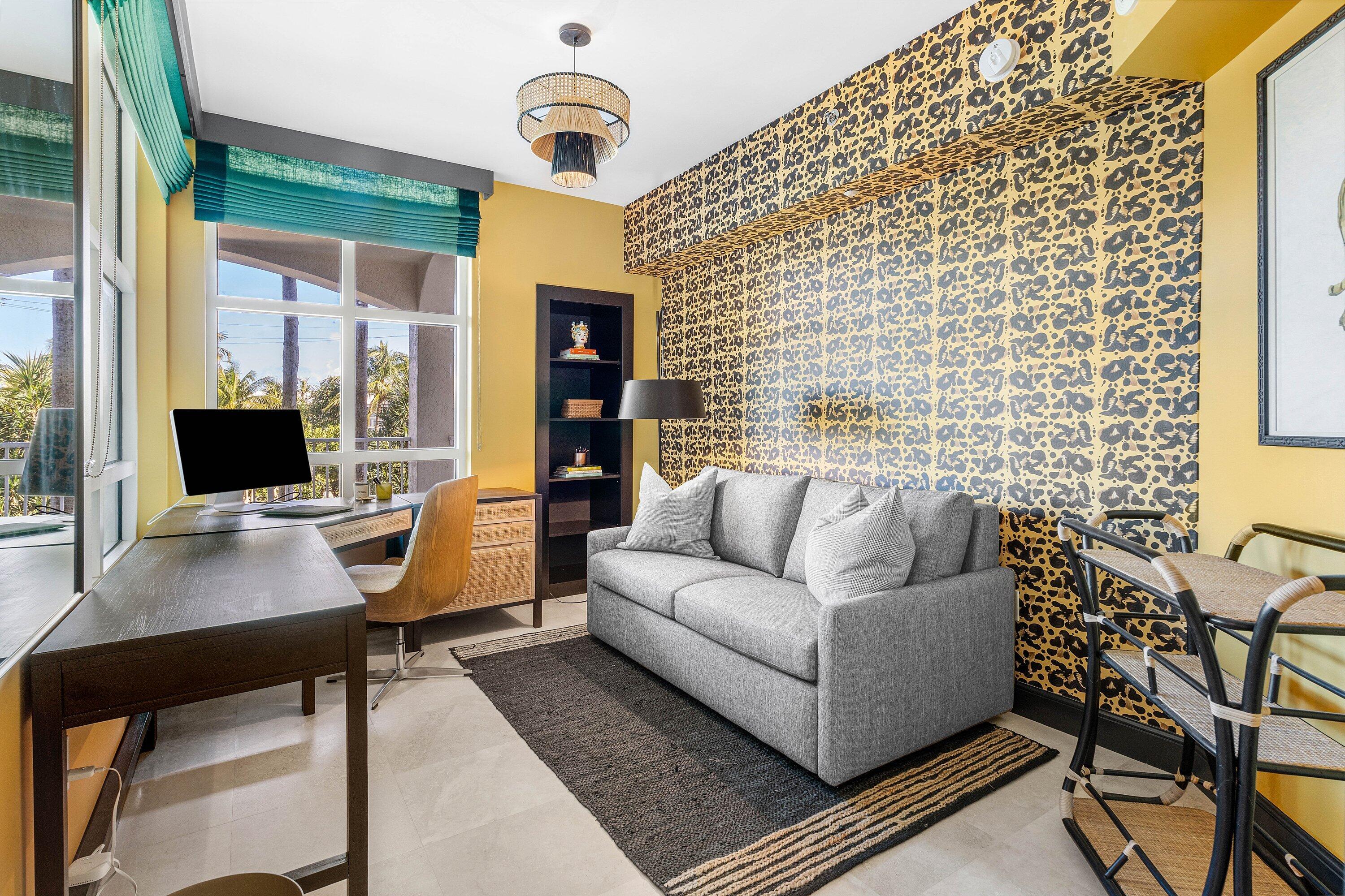 3700 South Ocean Boulevard, Unit 202 Highland Beach, FL 33487 - Photo 33 of 75 a living room with furniture and a flat screen tv