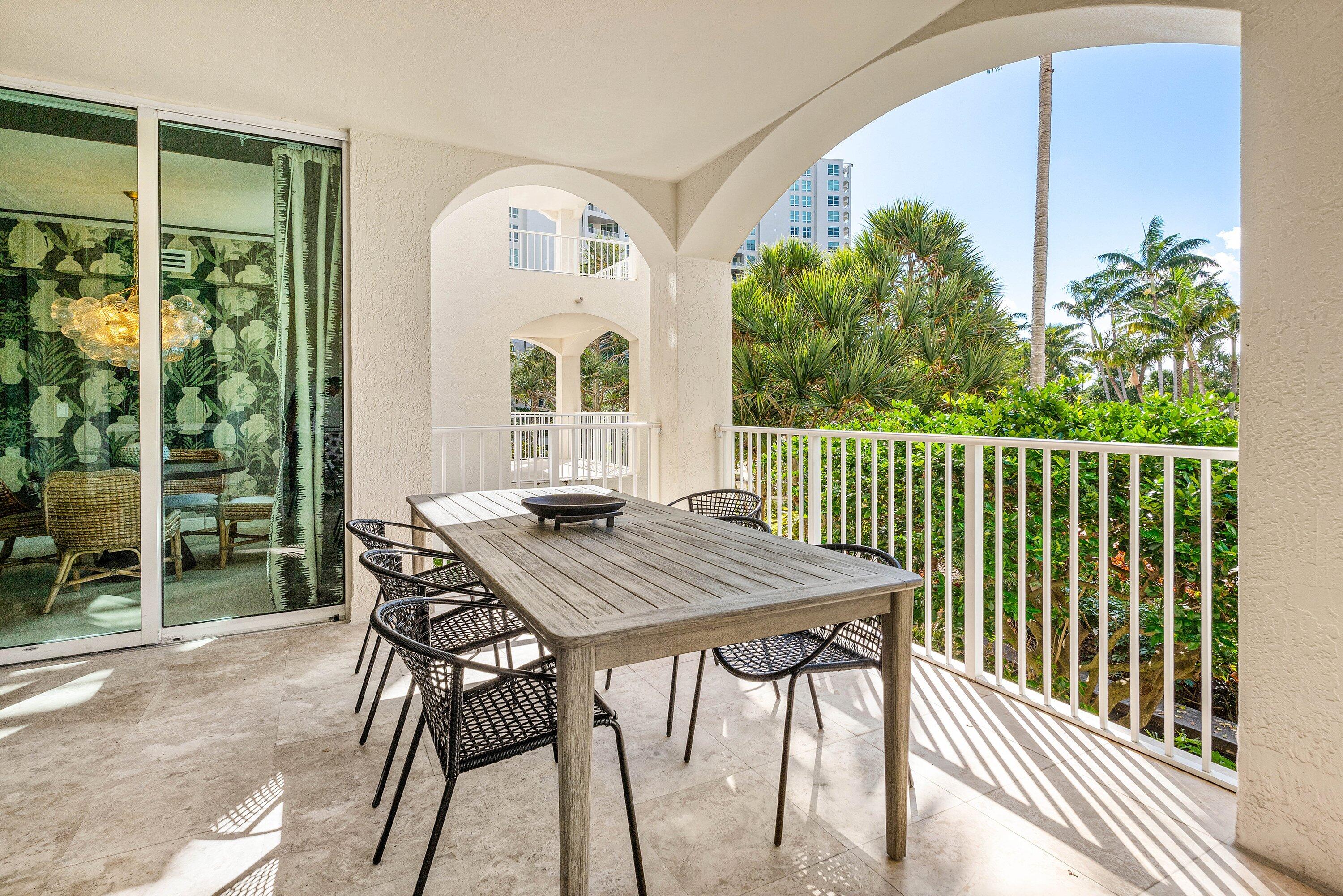 3700 South Ocean Boulevard, Unit 202 Highland Beach, FL 33487 - Photo 40 of 75 a view of a balcony dining table and chairs