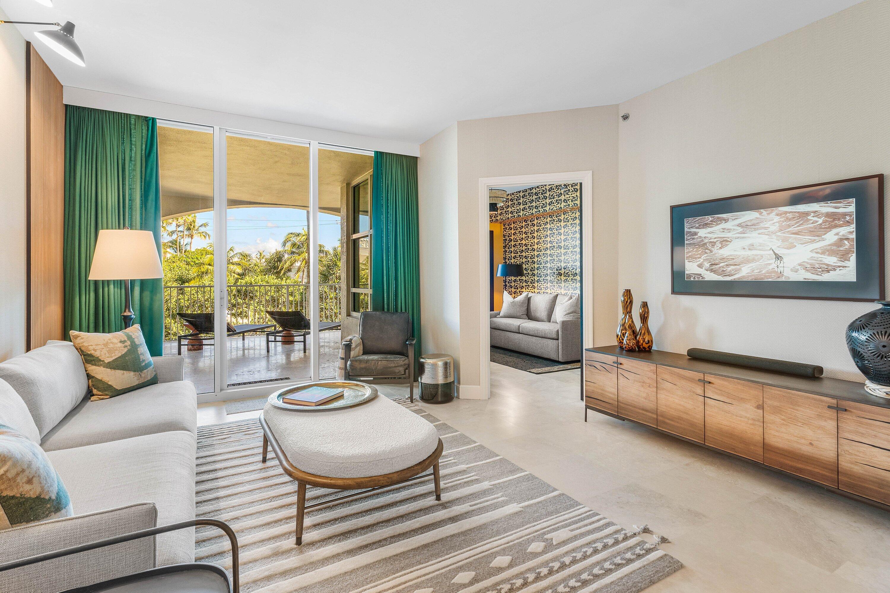 3700 South Ocean Boulevard, Unit 202 Highland Beach, FL 33487 - Photo 4 of 75 a living room with furniture and a large window
