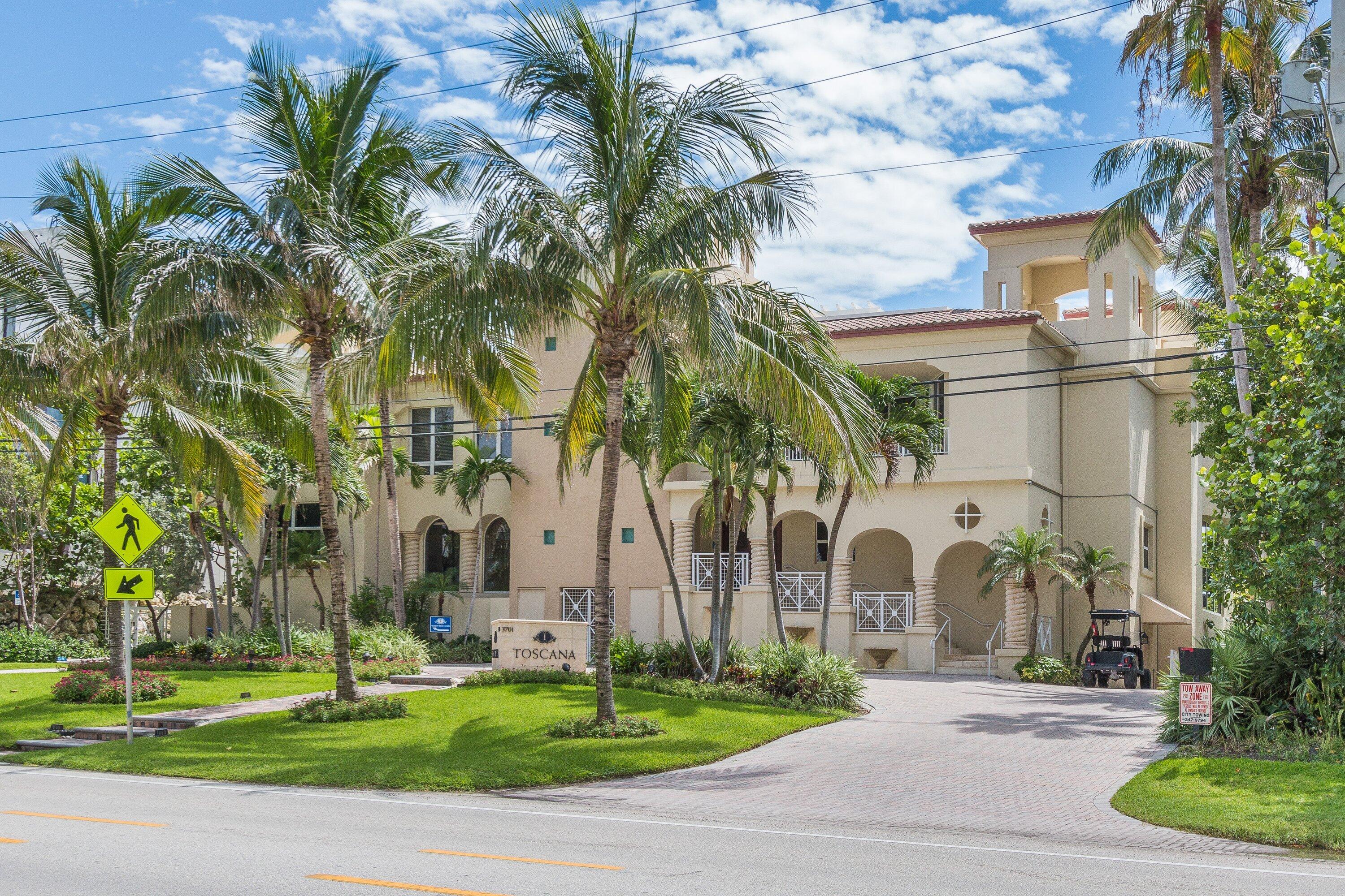 3700 South Ocean Boulevard, Unit 202 Highland Beach, FL 33487 - Photo 71 of 75 a group of palm trees sitting in front of a building