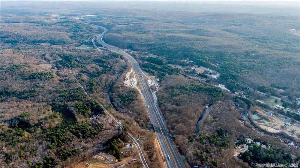 Tolland Stage Road Tolland, CT 06084 - Photo 8 of 11 a view of a forest with a street