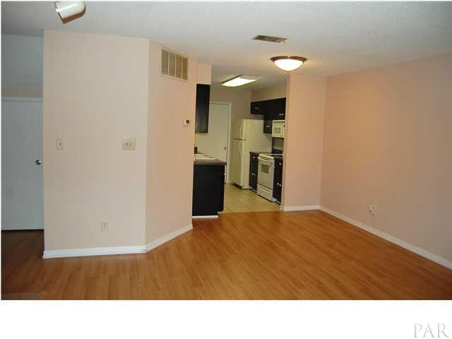 7150 Plantation Road, Unit 413 Pensacola, FL 32504 - Photo 6 of 21 The master bedroom is off the living room, has adjacent full bath and generous closet