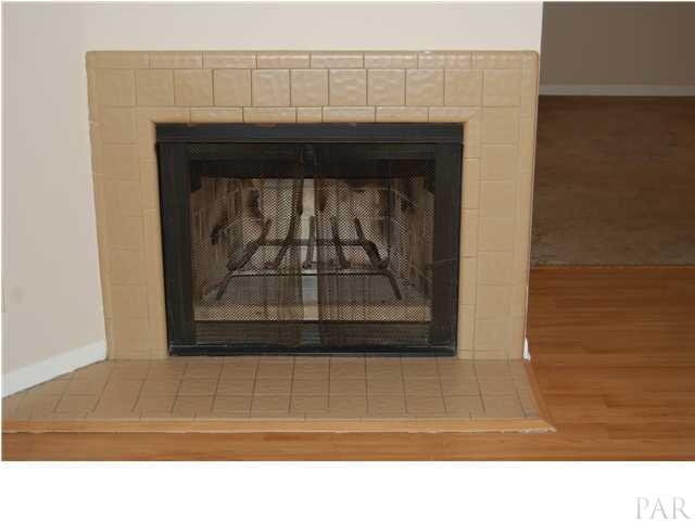 7150 Plantation Road, Unit 413 Pensacola, FL 32504 - Photo 7 of 21 Fireplace is a great focal point with plenty of room for a tv overhead or on the side wall