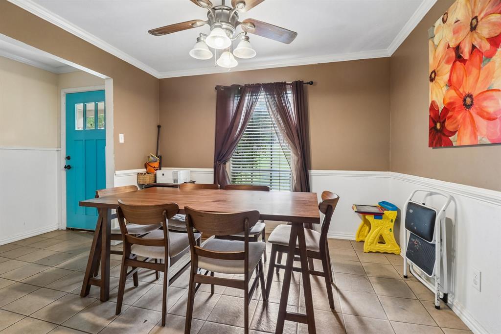 820 North Bowen Road Arlington, TX 76012 - Photo 15 of 40 a view of a dining room with furniture and wooden floor
