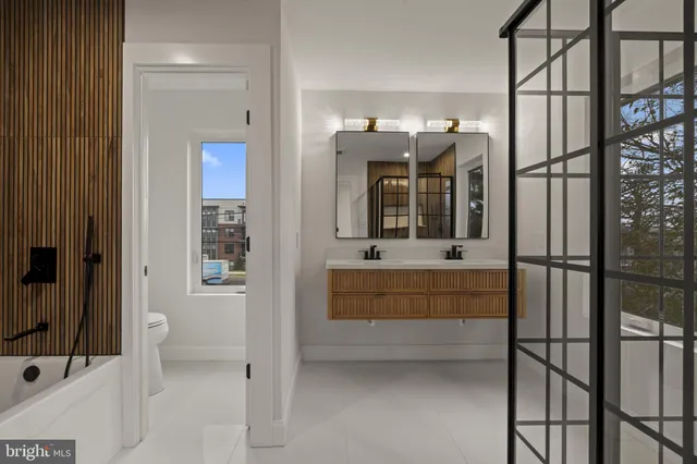 a bathroom with a glass shower door