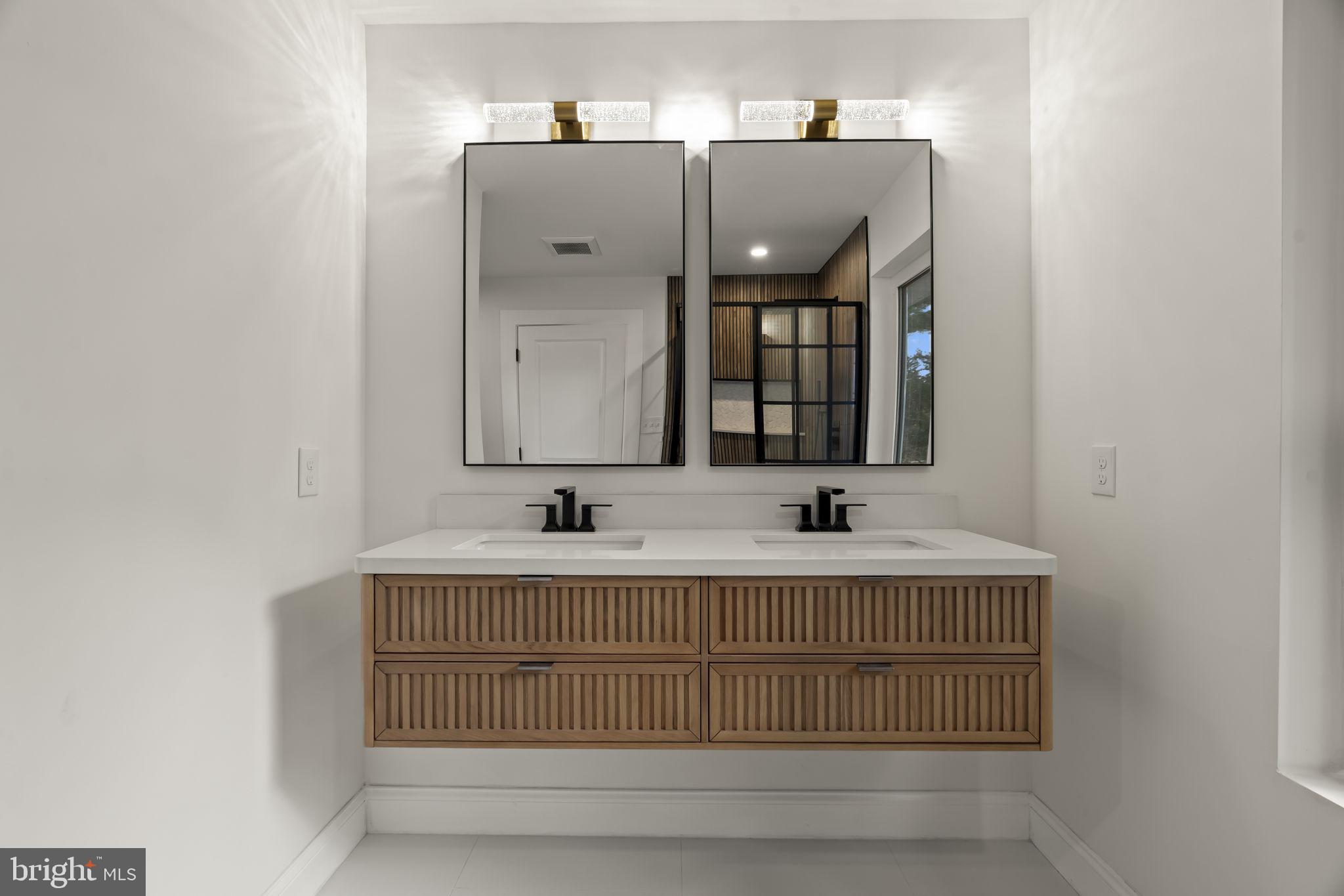 300 Witmer Road Horsham, PA 19044 - Photo 17 of 37 a bathroom with a sink and a mirror