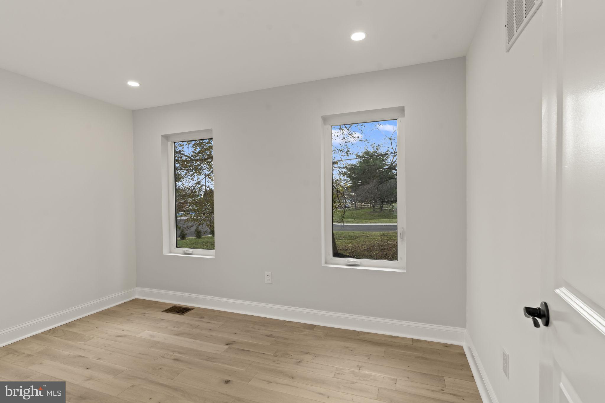 300 Witmer Road Horsham, PA 19044 - Photo 24 of 37 an empty room with wooden floor and windows