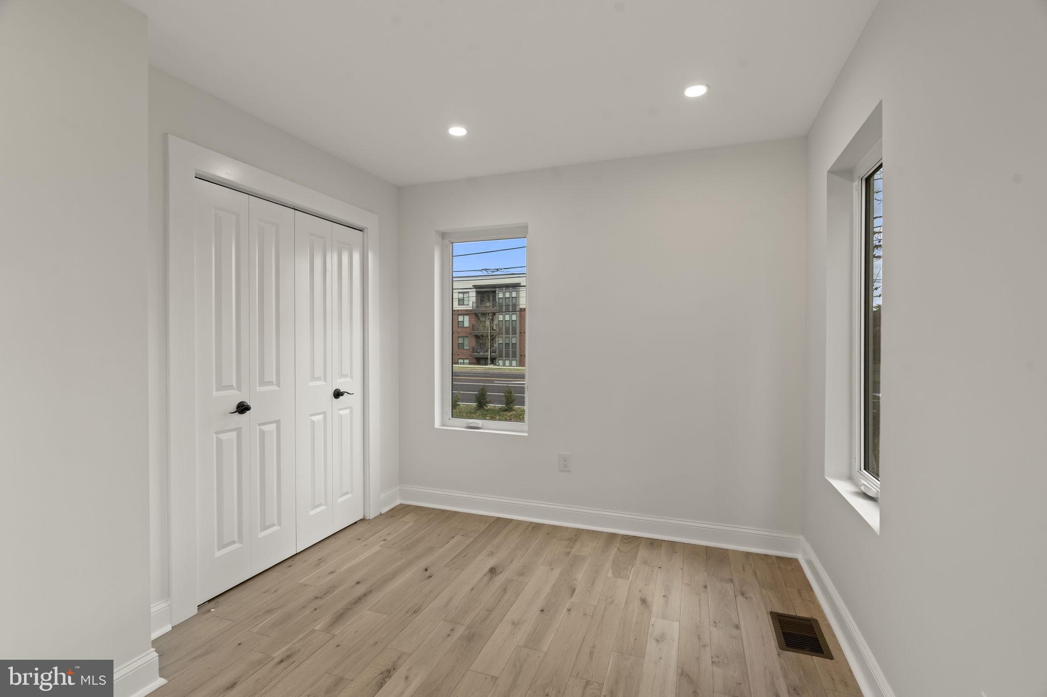 300 Witmer Road Horsham, PA 19044 - Photo 25 of 37 an empty room with wooden floor and windows