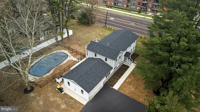 an aerial view of a house with a yard