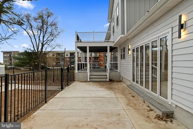 a view of a porch with wooden fence