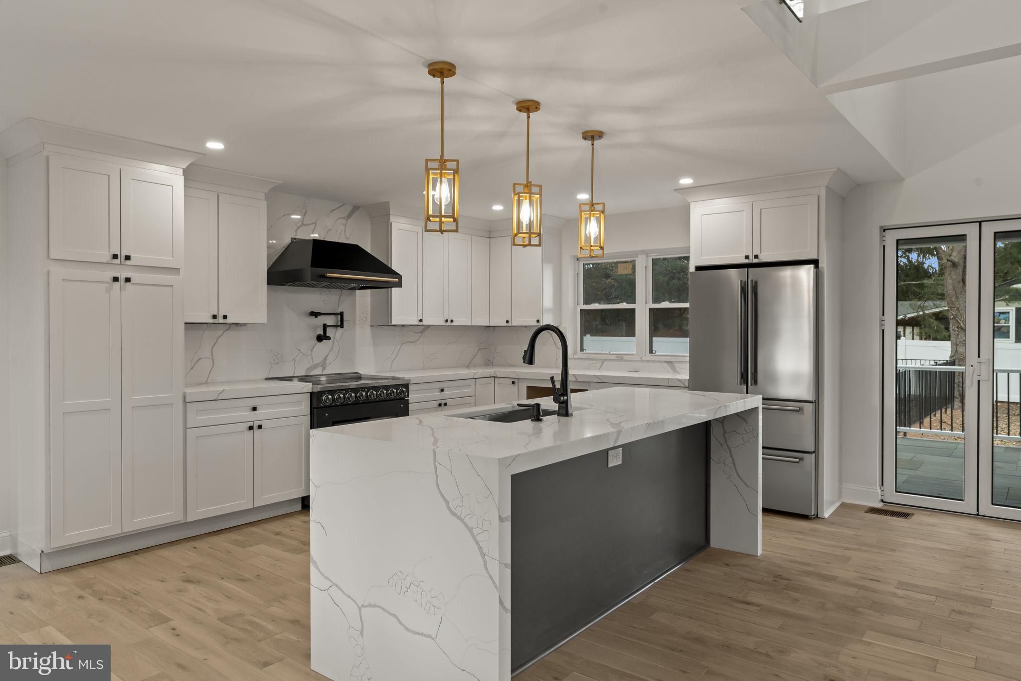300 Witmer Road Horsham, PA 19044 - Photo 7 of 37 a kitchen with stainless steel appliances granite countertop a sink stove and refrigerator