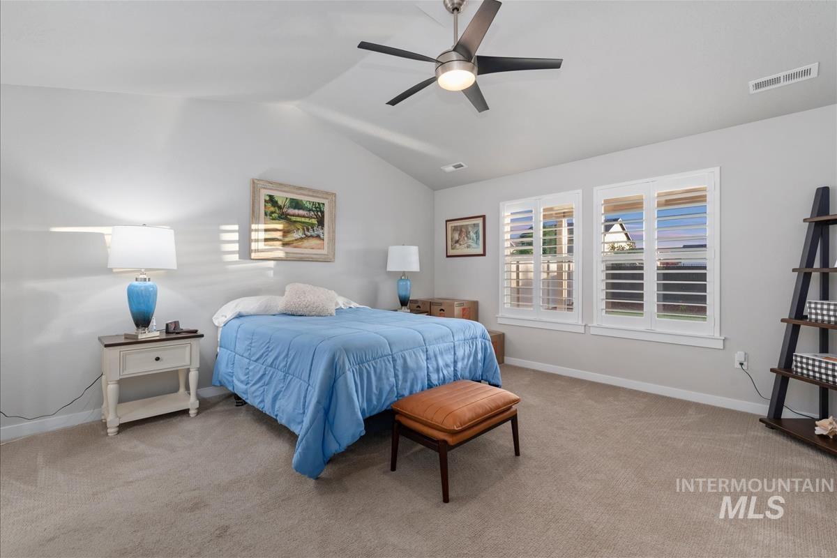 15451 Lutsen Avenue Caldwell, ID 83607 - Photo 19 of 39 Vaulted ceiling featuring a ceiling fan with integrated lighting