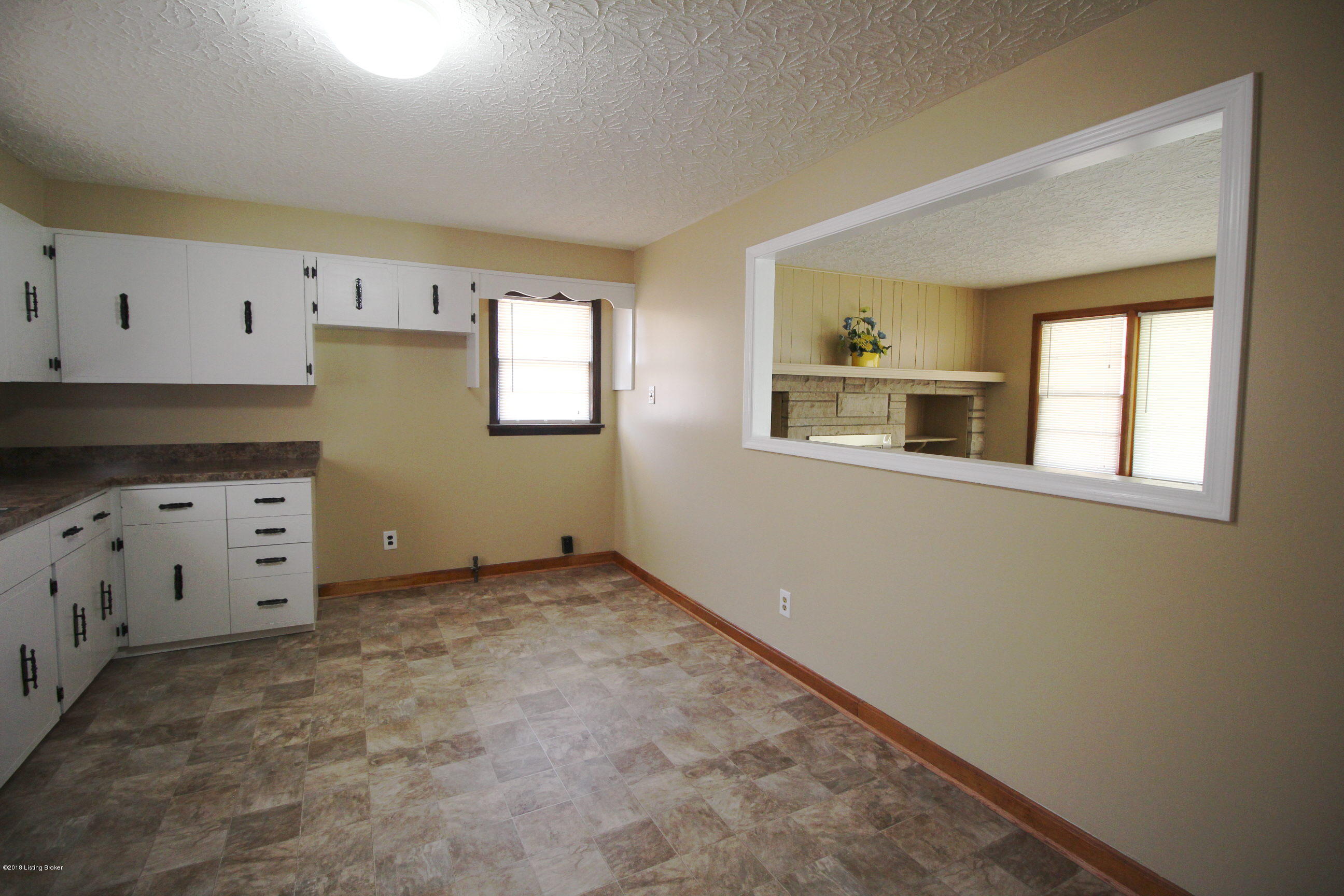4831 Dover Road Louisville, KY 40216 - Photo 7 of 26 OPENING BETWEEN KITCHEN AND LIVING ROOM