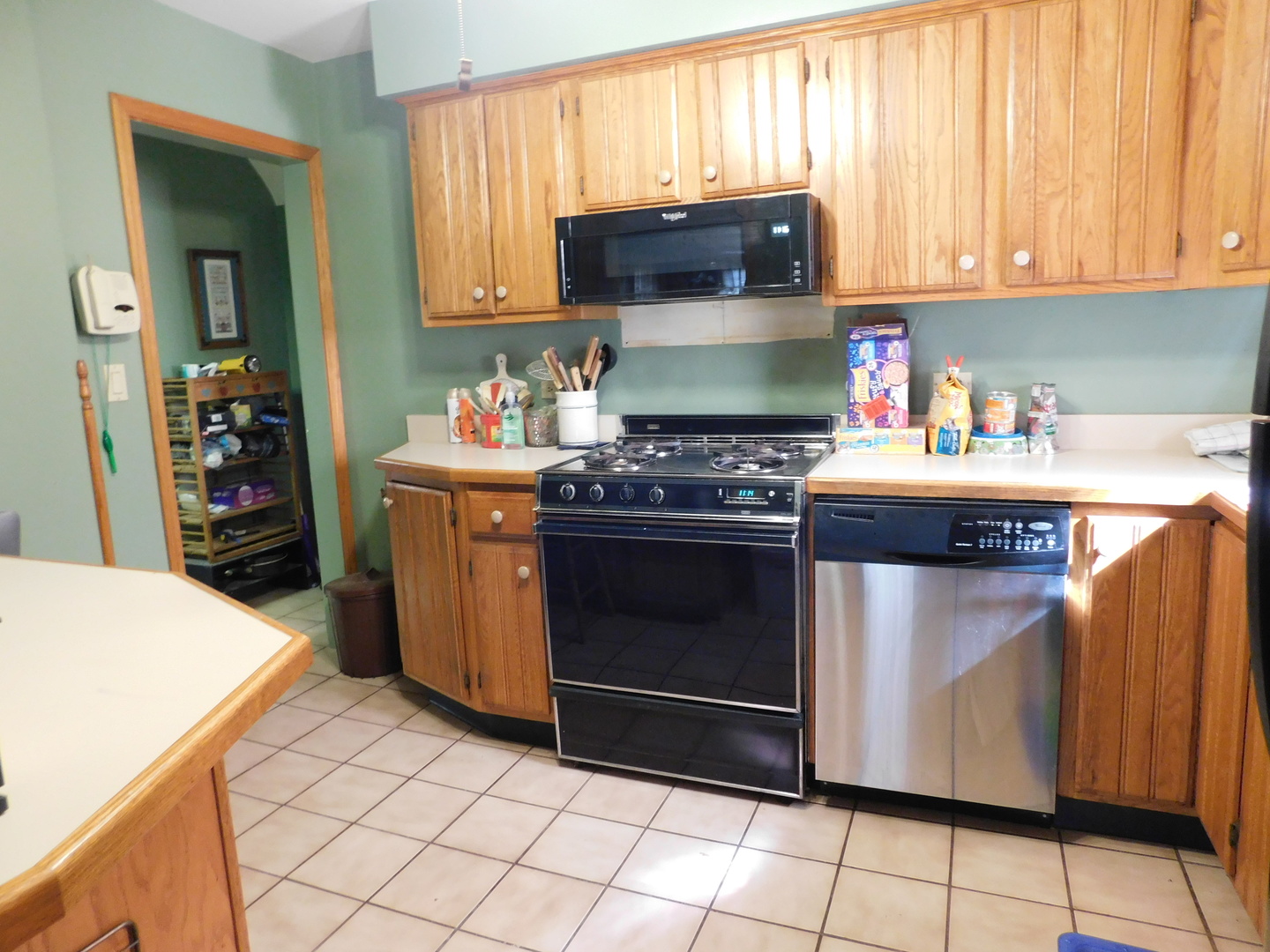 7621 East Prairie Road Skokie, IL 60076 - Photo 3 of 11 a kitchen with a stove and a refrigerator