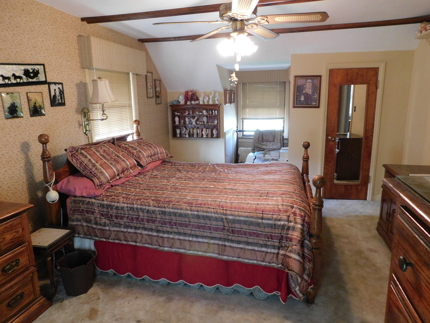 7621 East Prairie Road Skokie, IL 60076 - Photo 8 of 11 a bedroom with a bed and a chandelier