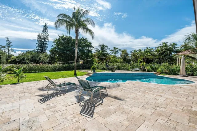 a view of outdoor space with swimming pool