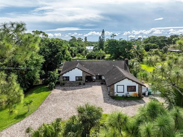 a house with trees in the background