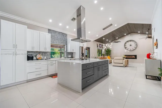 a kitchen with cabinets and window