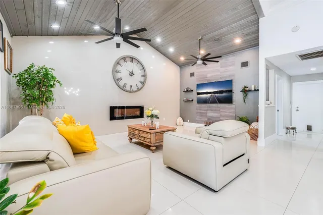 a living room with furniture and a clock