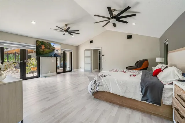 a bedroom with bed and window