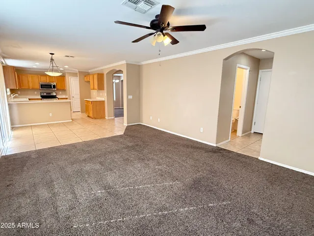 a view of a livingroom with a kitchen