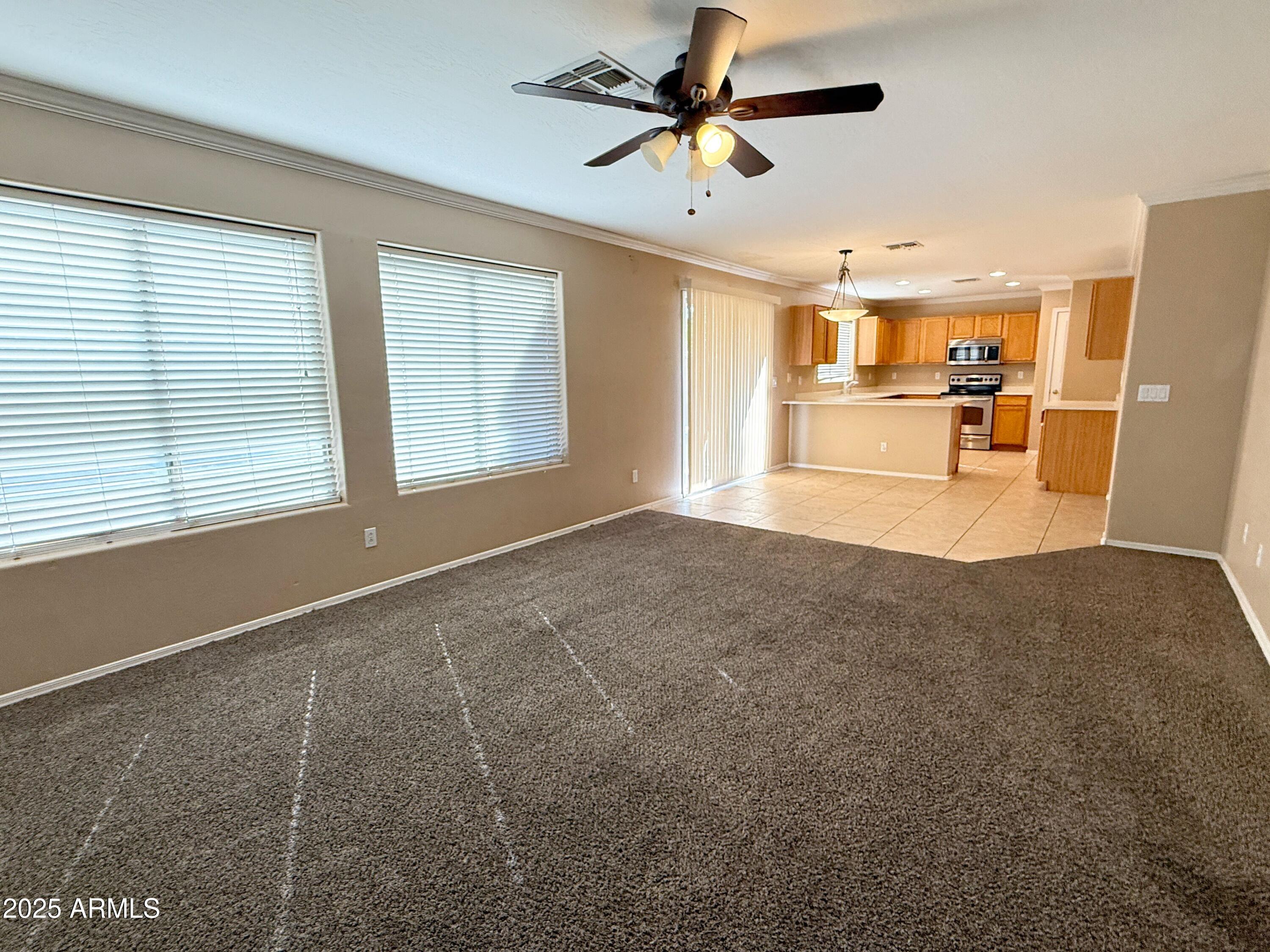 3363 East Flamingo Court Gilbert, AZ 85297 - Photo 14 of 29 a view of empty room with wooden floor and window