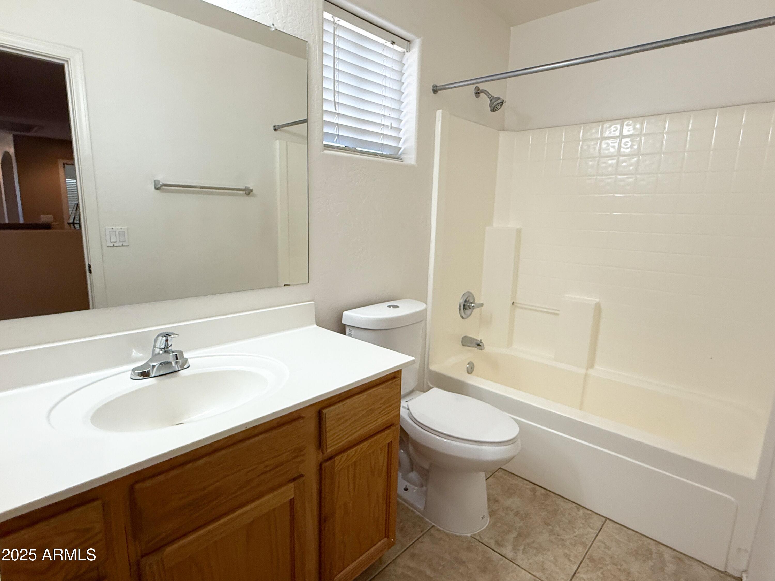 3363 East Flamingo Court Gilbert, AZ 85297 - Photo 24 of 29 a bathroom with a sink a toilet and a bathtub