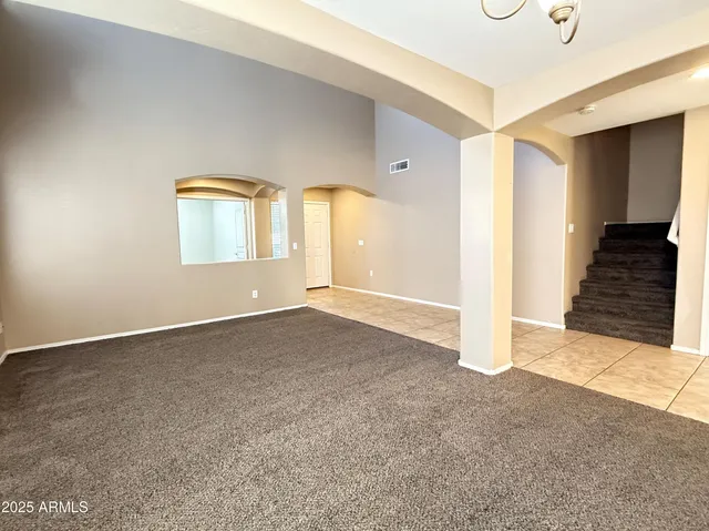 a view of an empty room and window