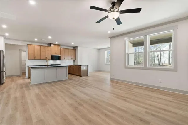 a view of a kitchen with a sink and cabinet