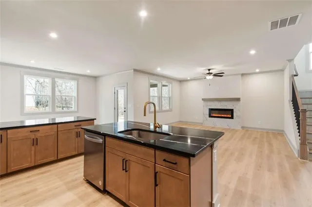 a kitchen with sink cabinets and window
