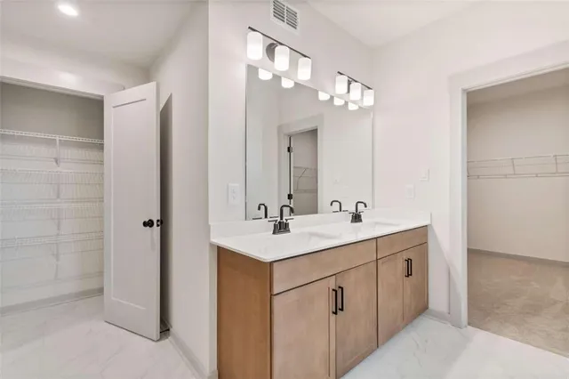 a white bath tub sitting next to a shower