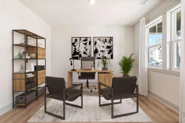 a dining room with furniture and window