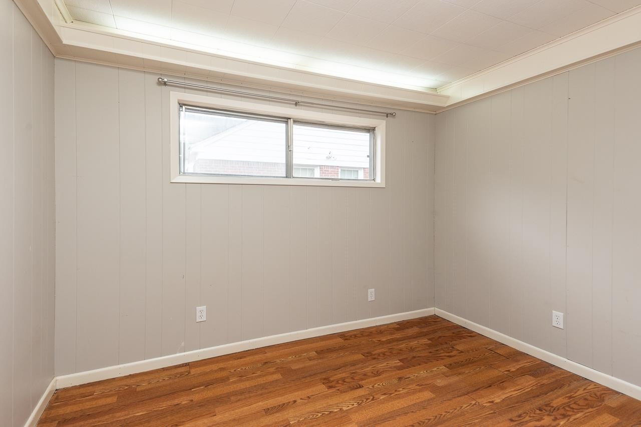 1368 South Perkins Road Memphis, TN 38117 - Photo 7 of 21 a view of an empty room with wooden floor and a window