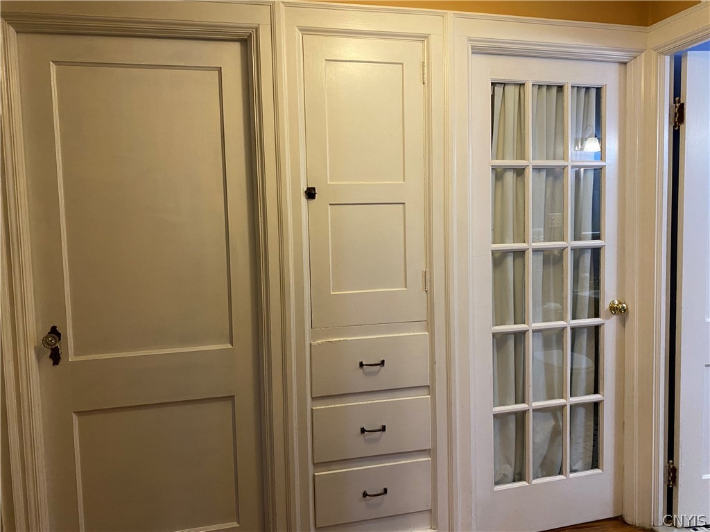 87 Ballantyne Brae Utica, NY 13501 - Photo 19 of 27 First Floor Hallway w/L;inen Cabinet