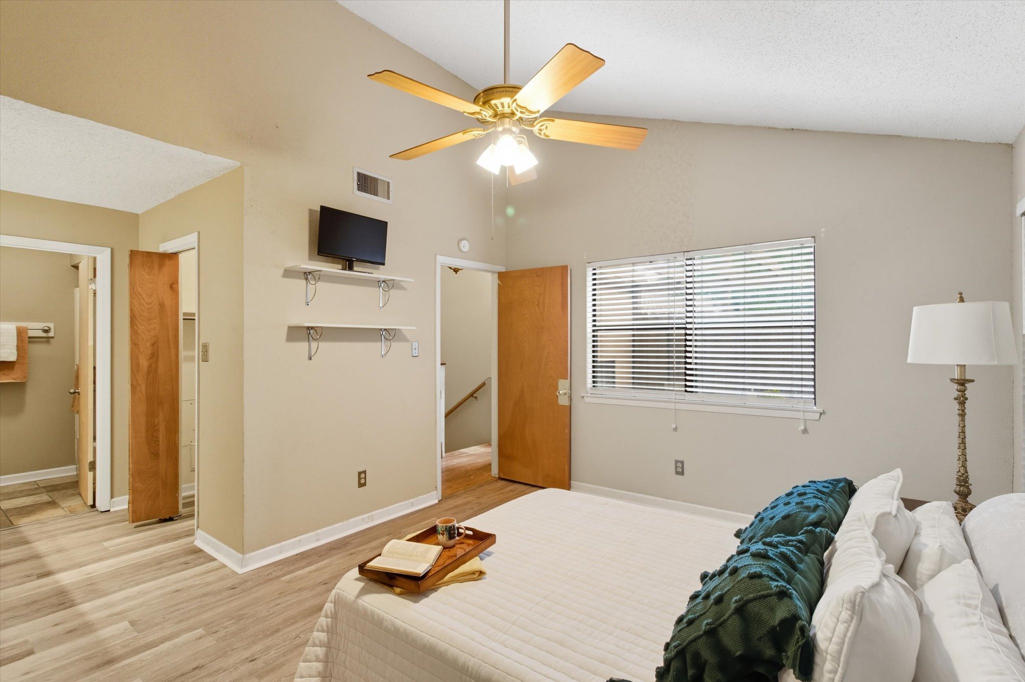 821 Old Ranch Road San Marcos, TX 78666 - Photo 9 of 29 a bedroom with a bed and a chandelier