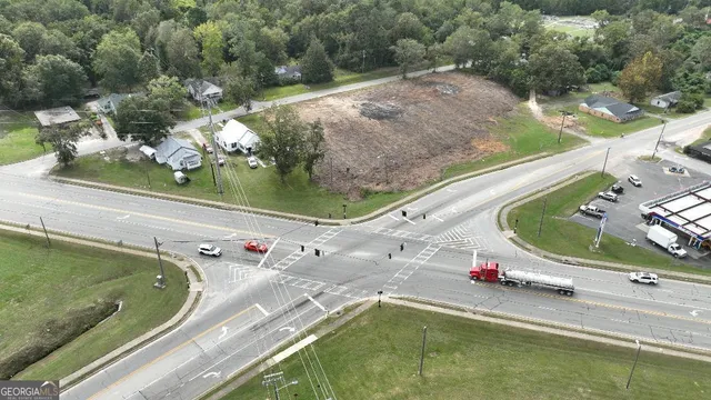 a view of a swimming pool with a yard