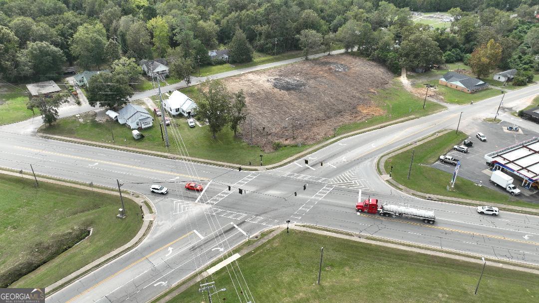 a view of a swimming pool with a yard