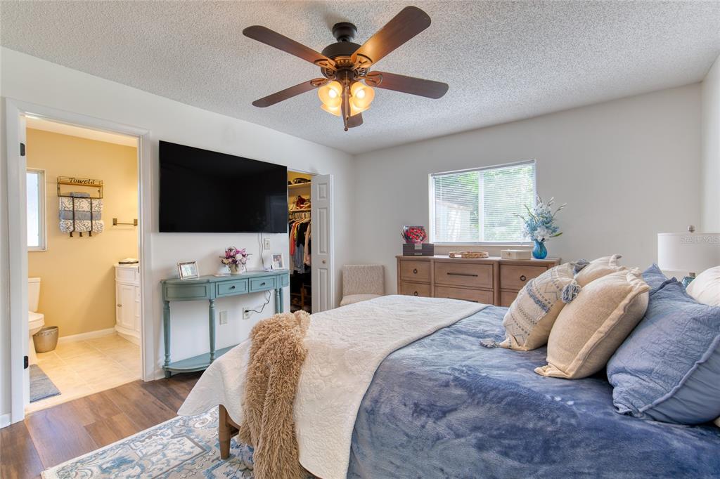 23 Fallon Lane Palm Coast, FL 32137 - Photo 27 of 77 a bedroom with a bed and a flat screen tv